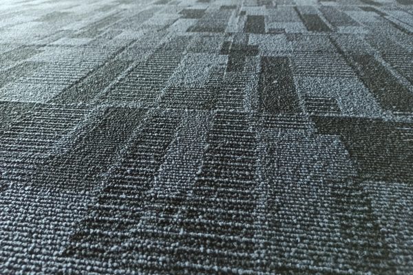 Blue color fabric background. Dark blue office carpet pattern interior. safety flooring